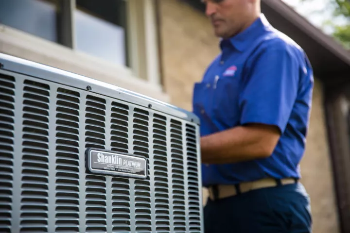 Shanklin technician repairing an outdoor air conditioning unit in Orrville, OH